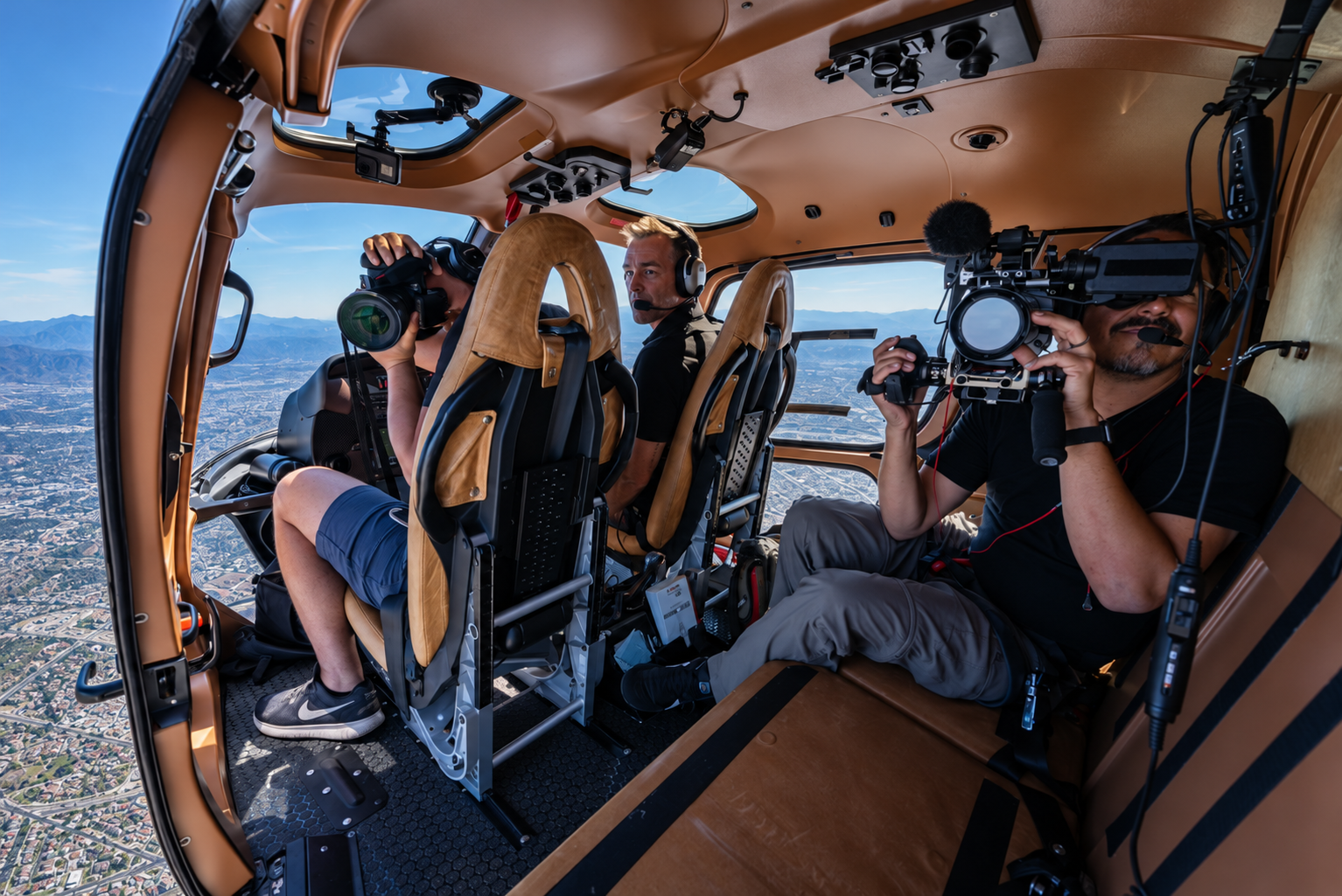 Documentary camera crew filming from a helicopter above Los Angeles